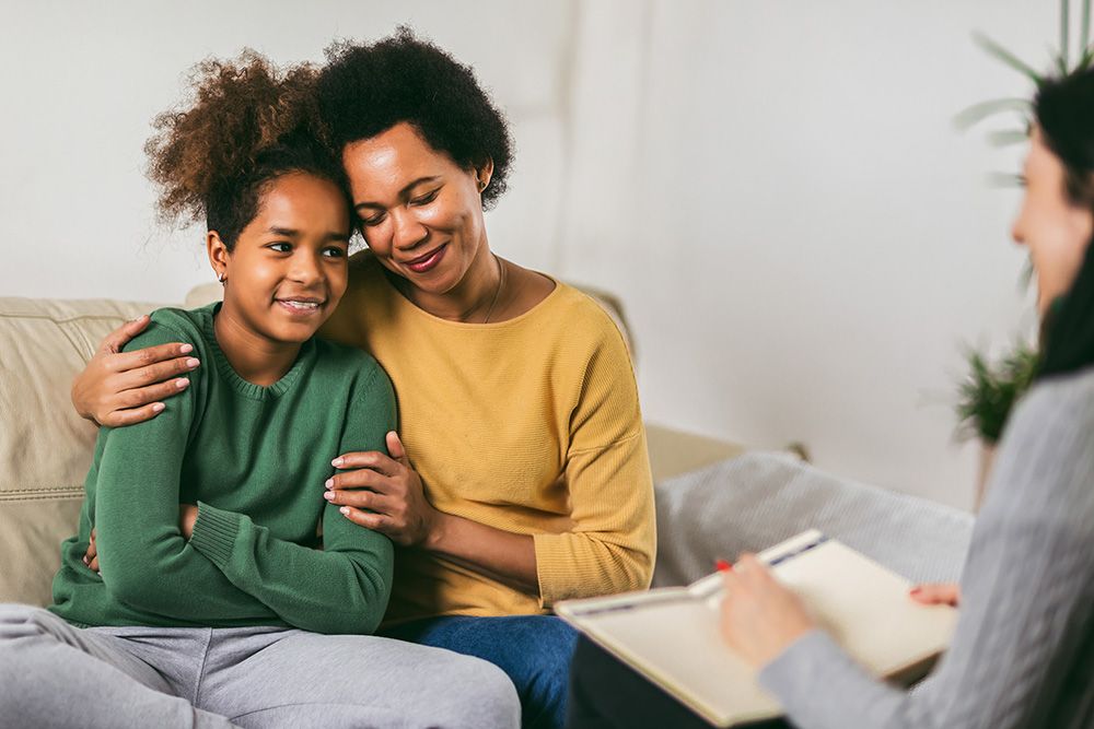 Mother and daughter with therapist