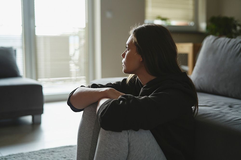 Woman looking out a window